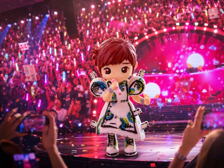 A superimposed photo of Stefanie Sun toy figure at her Aut Nihilo concert tour